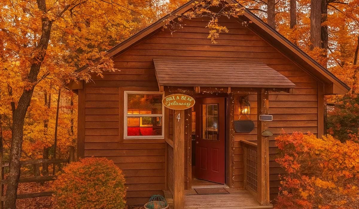 Cozy wooden cabin surrounded by vibrant autumn foliage. Cozy wooden cabin surrounded by vibrant autumn foliage.
