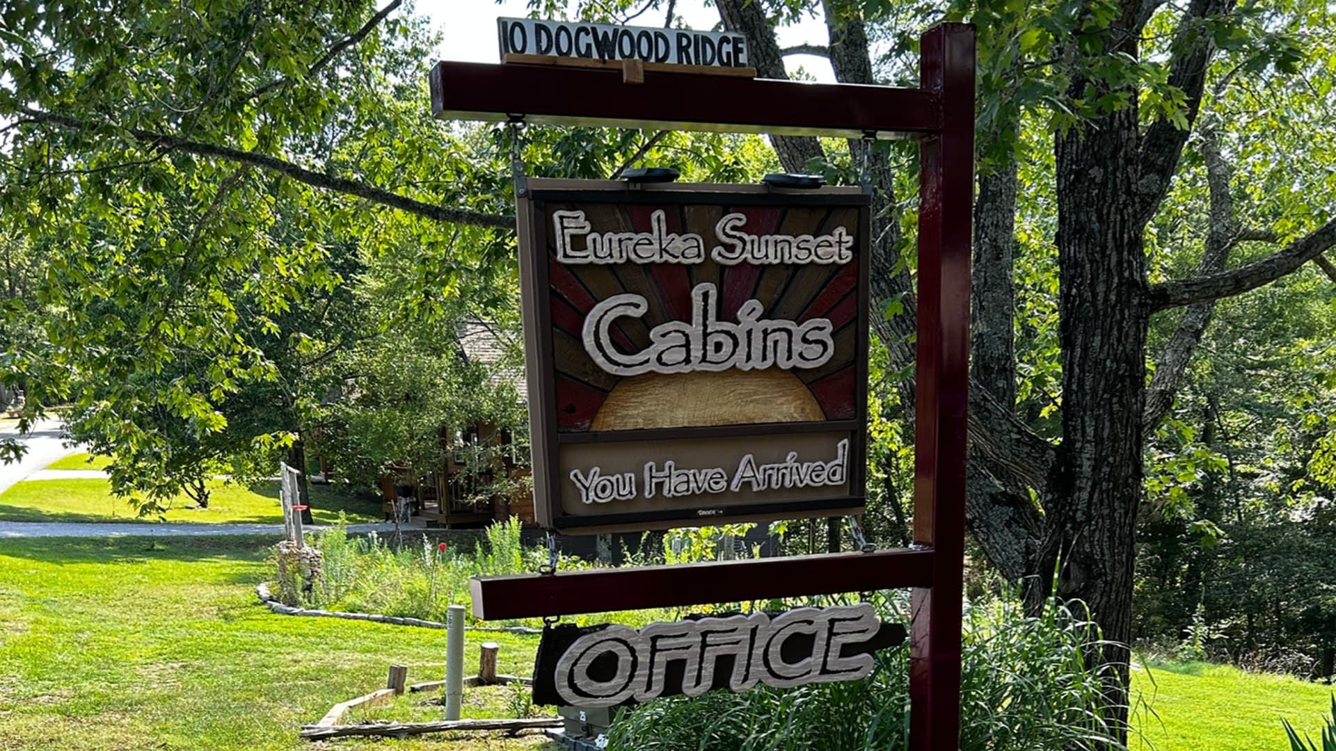 Sign for Eureka Sunset Cabins indicating the office location.