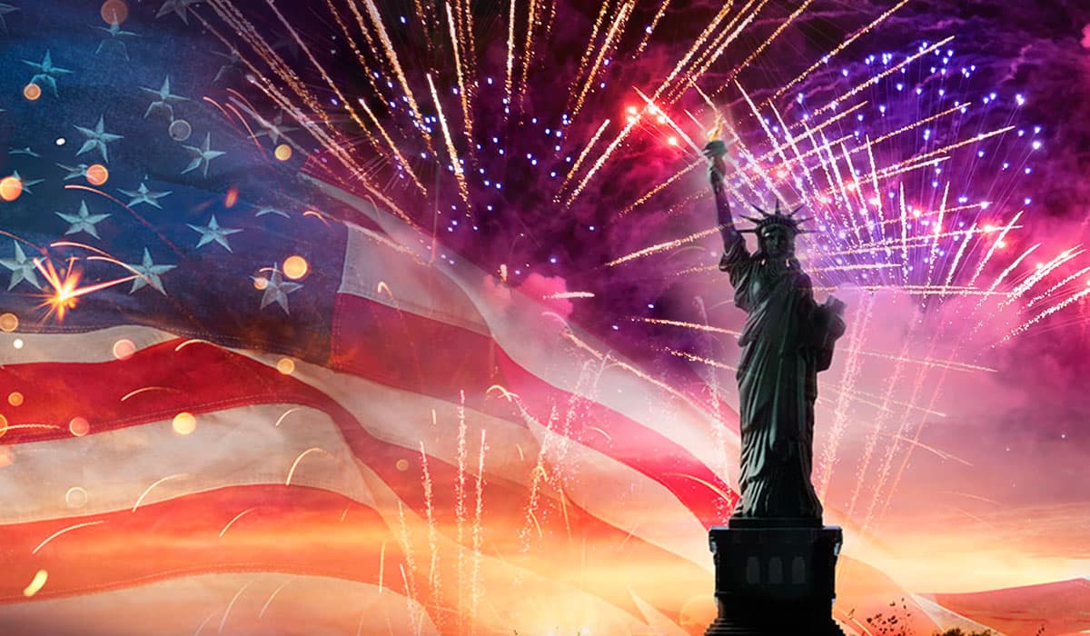 The Statue of Liberty stands in front of a vibrant backdrop of fireworks and the American flag. The Statue of Liberty stands in front of a vibrant backdrop of fireworks and the American flag.